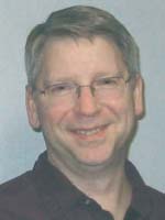 [Photo of Scott W. Baker]
