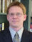 Mr. Andrew J. Coulson