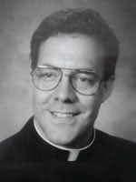 [Photo of Father Robert A. Sirico]