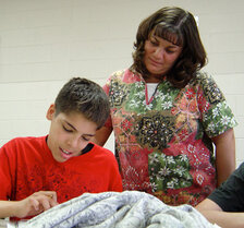 Teacher helping student