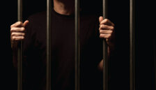 Man behind prison bars