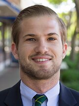 [Photo of Derek Draplin]