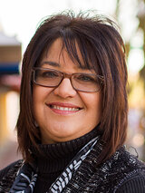 [Photo of Lori Schumann]