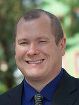 [Photo of Christopher Smith]