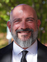 [Photo of Steve Caruso]