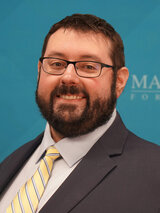 [Photo of Stephen Delie]