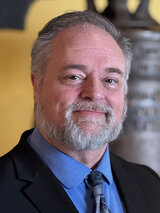 [Photo of Mick McArt]
