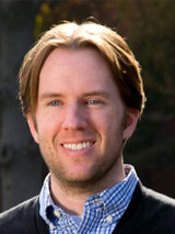 [Photo of Dr. Michael Thom]