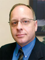 [Photo of John Fitzgerald Szczubelek, J.D.]