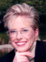 [Photo of Karen De Coster]