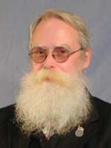 [Photo of Keith G. Harrison]