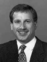 [Photo of John M. Kost]