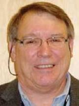 [Photo of Dr. Wayne D. Lancaster]