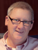 [Photo of Paul Mitchell]