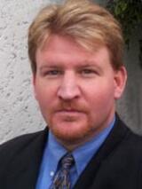 [Photo of Jon B. Perdue]