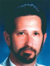 [Photo of Frank L. Reid]