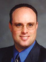 [Photo of Brian Scoles]