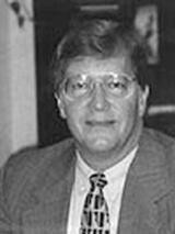 [Photo of Dr. Michael S. Shibler]