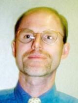 [Photo of Dr. Dirk C. Van Raemdonck]